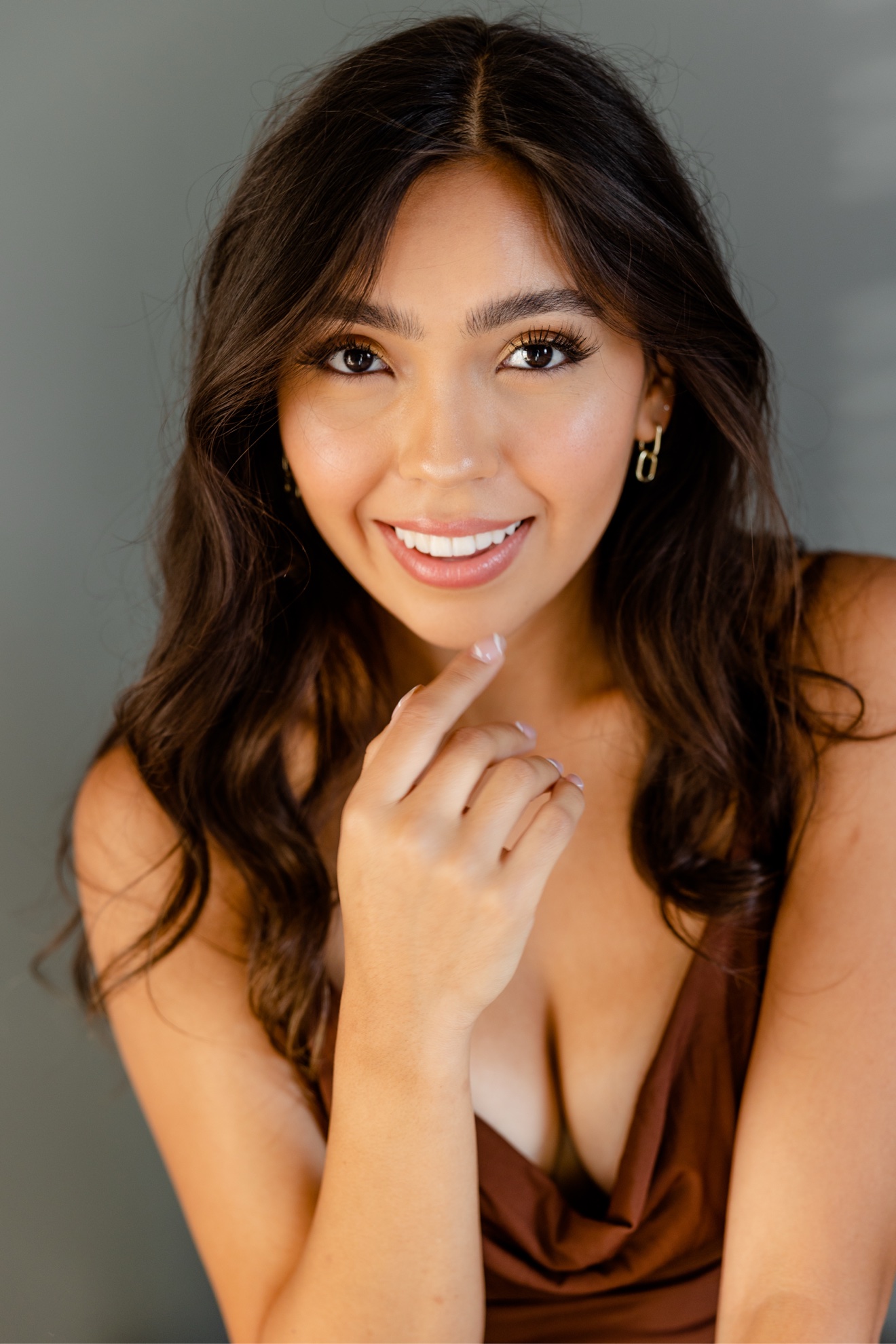 Chelsey Carlson — Headshot — Smiling (brown cowl)